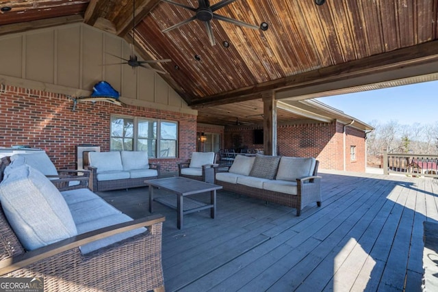 deck featuring an outdoor living space and ceiling fan