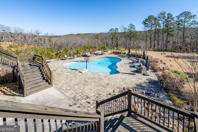 view of pool featuring a patio area