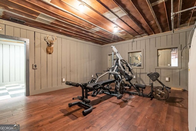 workout area with hardwood / wood-style floors and wooden ceiling