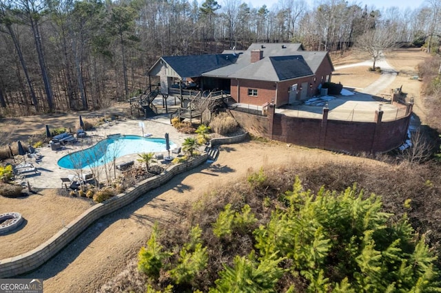 view of pool featuring a patio