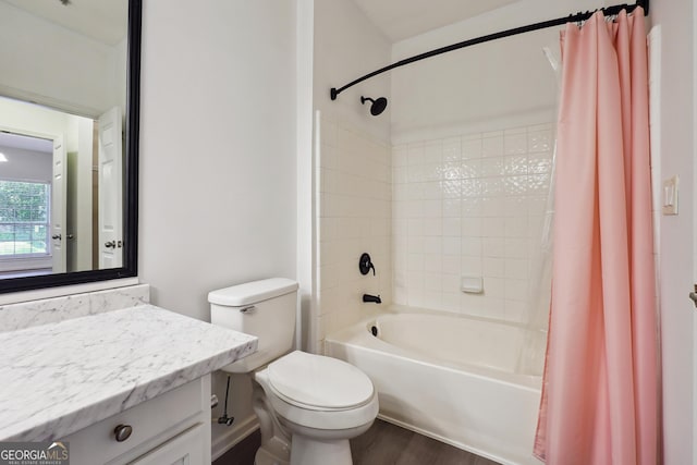 full bathroom featuring toilet, vanity, shower / bath combo with shower curtain, and hardwood / wood-style flooring