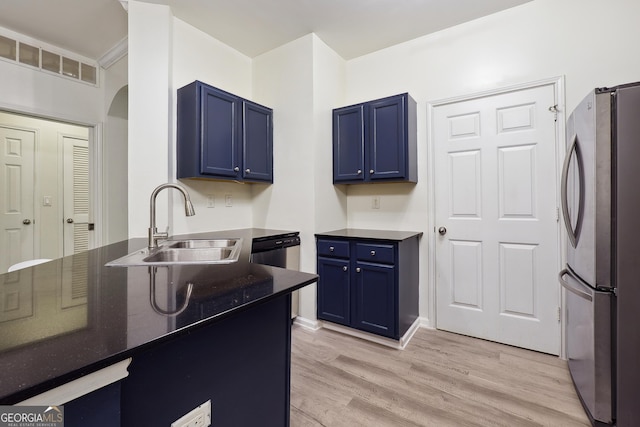 kitchen with light wood-type flooring, sink, appliances with stainless steel finishes, and blue cabinets