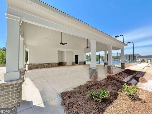 view of patio / terrace featuring ceiling fan