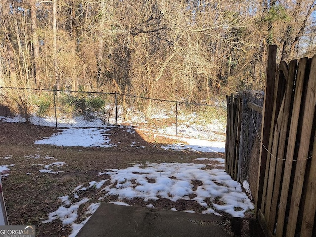 view of yard covered in snow