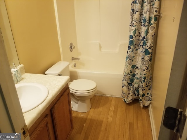 full bathroom featuring toilet, vanity, shower / bath combo, and hardwood / wood-style floors