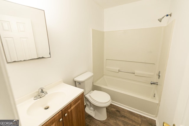 full bathroom featuring tub / shower combination, hardwood / wood-style floors, toilet, and vanity