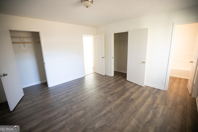 unfurnished bedroom featuring dark hardwood / wood-style flooring