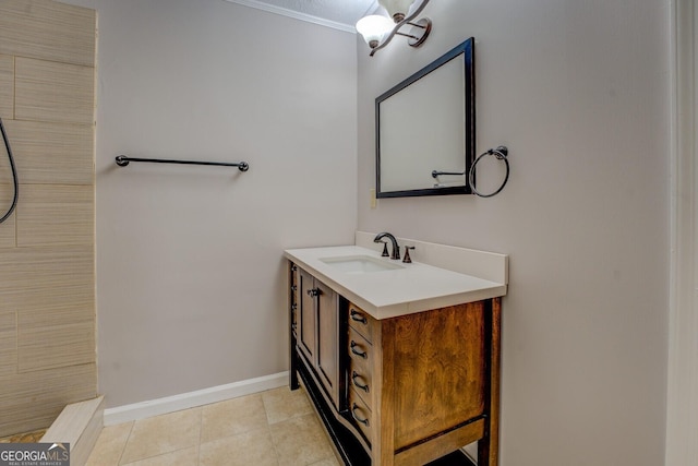 bathroom with ornamental molding, tile patterned flooring, and vanity