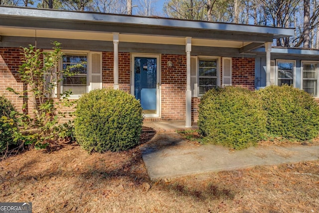 entrance to property with a porch