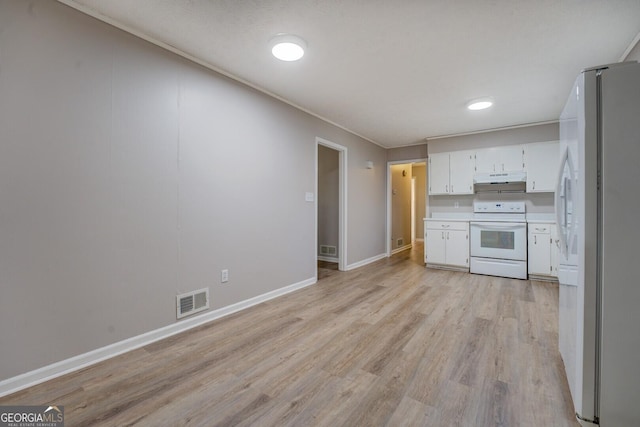 kitchen featuring light wood-type flooring, white appliances, and white cabinetry