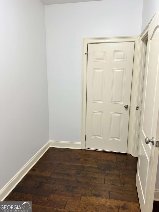 spare room featuring dark hardwood / wood-style flooring