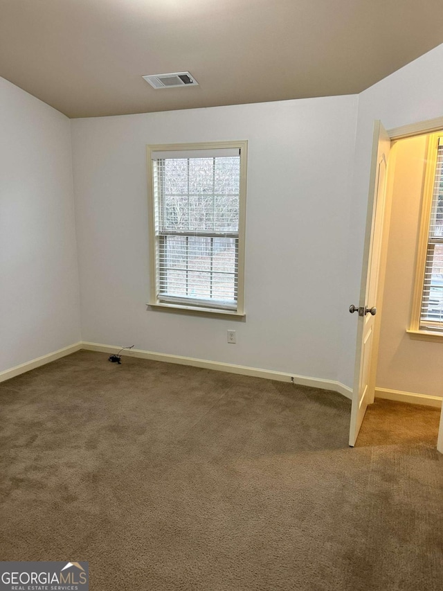 spare room with carpet flooring