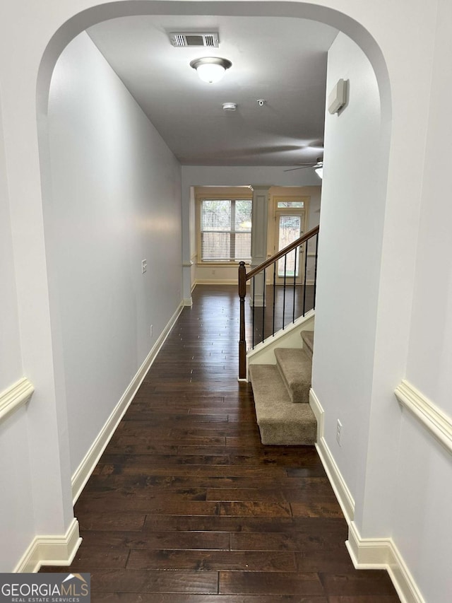 corridor with dark wood-type flooring