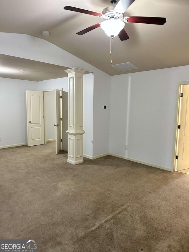 basement featuring ceiling fan and light colored carpet