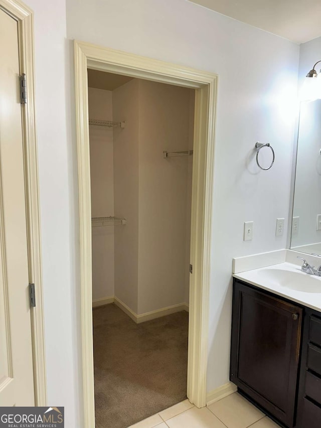 bathroom featuring tile patterned floors and vanity