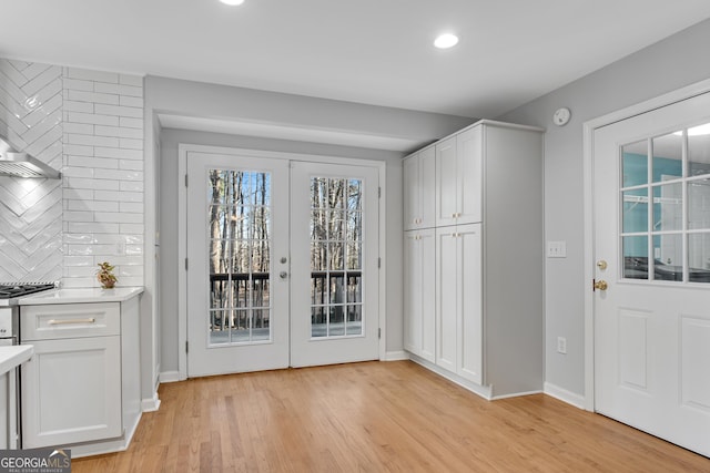 doorway to outside featuring light wood-type flooring and french doors