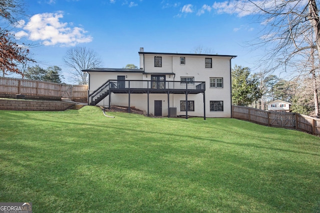 back of house featuring cooling unit, a lawn, and a deck