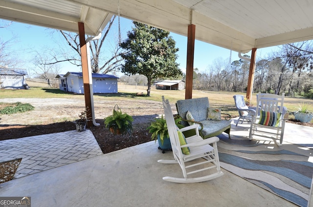 view of patio / terrace with an outbuilding