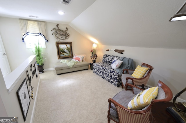 sitting room with light colored carpet and vaulted ceiling