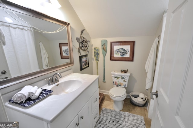 bathroom featuring vaulted ceiling, toilet, a shower with shower curtain, and vanity