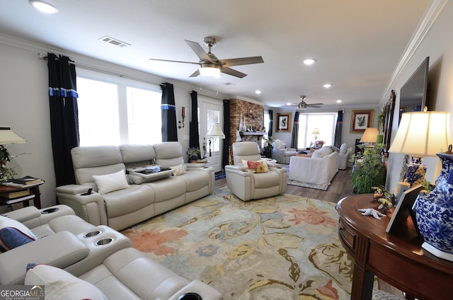 living room featuring ceiling fan, crown molding, and hardwood / wood-style floors