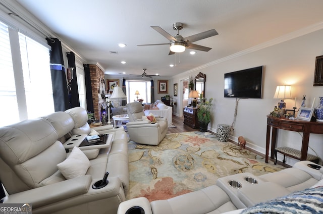 living room with ceiling fan, crown molding, and hardwood / wood-style floors