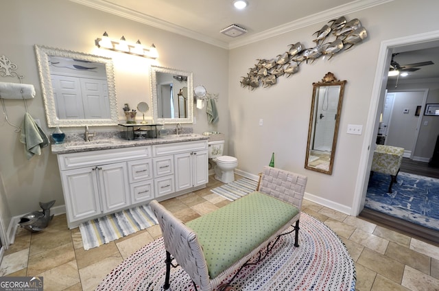 bathroom featuring ceiling fan, toilet, vanity, and crown molding