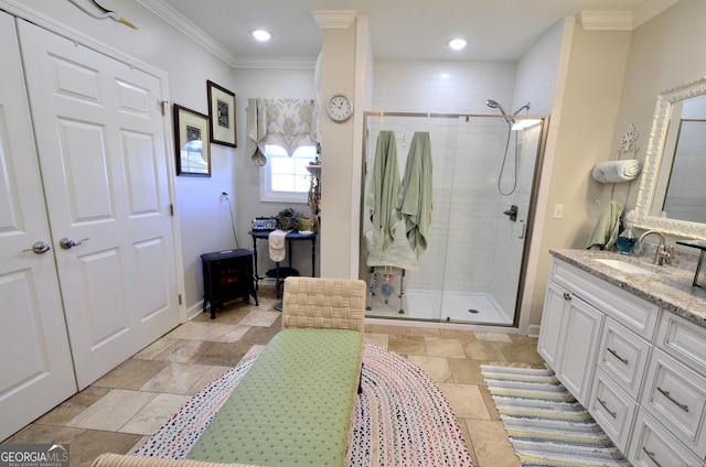 bathroom with walk in shower, crown molding, and vanity