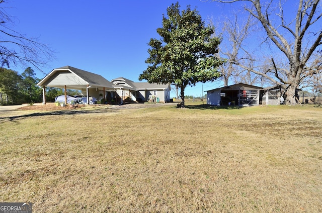 view of yard with a carport