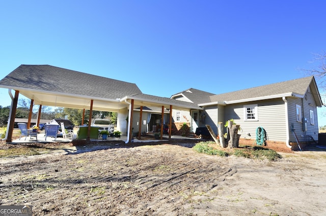 rear view of property featuring a patio