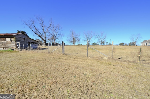 view of yard with a rural view