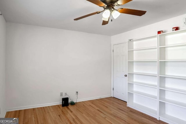 unfurnished bedroom with ceiling fan and light hardwood / wood-style flooring