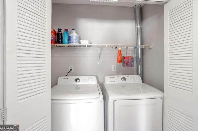 laundry room featuring washer and clothes dryer