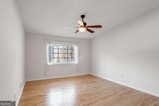 unfurnished room featuring ceiling fan and light hardwood / wood-style flooring