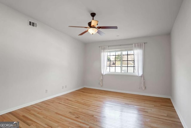 spare room featuring ceiling fan and light wood-type flooring