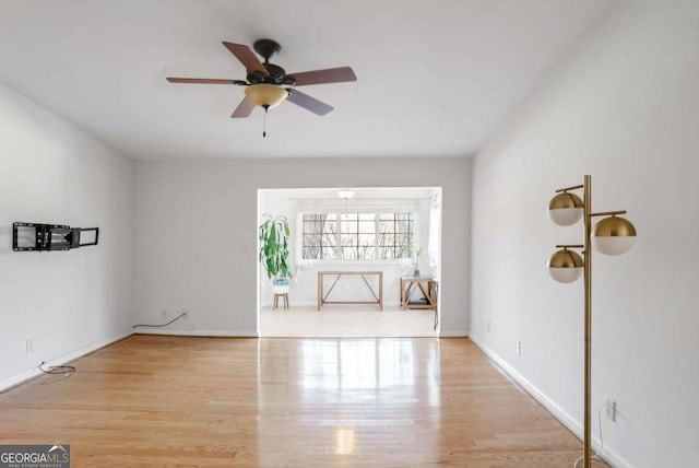 unfurnished room with light hardwood / wood-style floors and ceiling fan