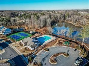 birds eye view of property with a water view