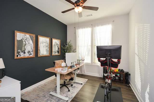 office space with ceiling fan and dark hardwood / wood-style flooring