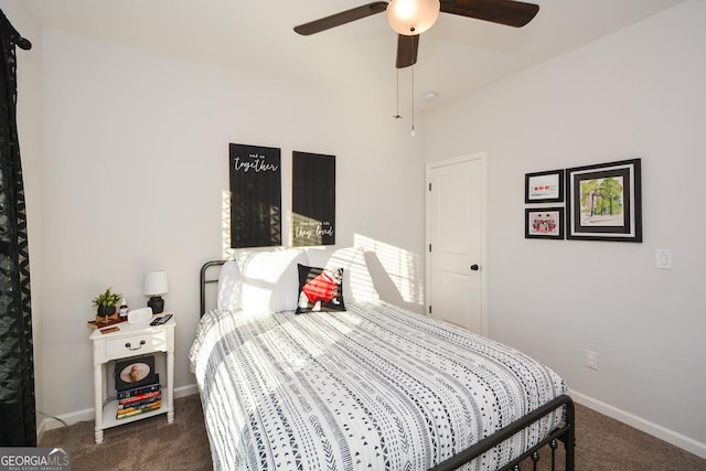 bedroom featuring dark colored carpet and ceiling fan