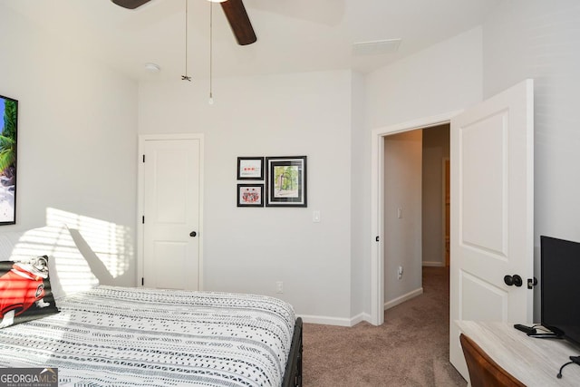 bedroom featuring ceiling fan and carpet