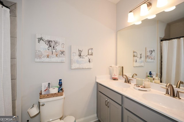 bathroom with vanity and toilet