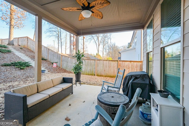 sunroom with plenty of natural light and ceiling fan