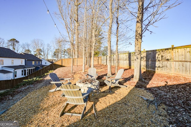 view of yard with a fire pit