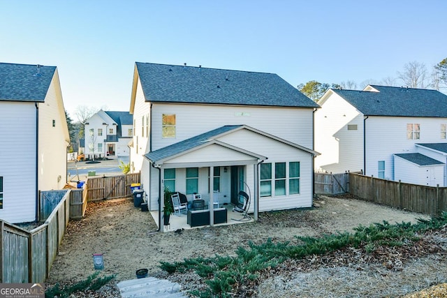 back of house with a patio area