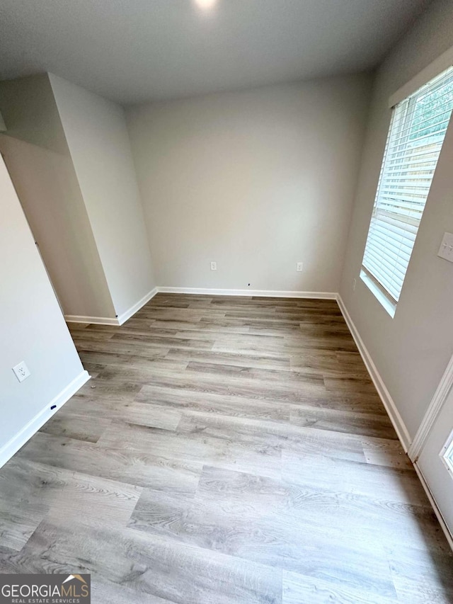 unfurnished room featuring light hardwood / wood-style flooring