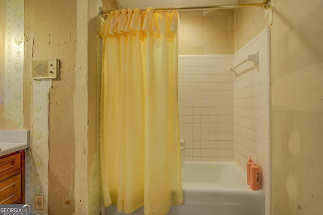 bathroom featuring vanity and shower / bath combo with shower curtain