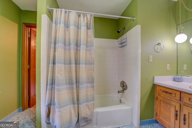 bathroom with vanity, tile patterned flooring, shower / bath combo with shower curtain, and a textured ceiling