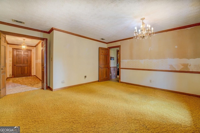 spare room featuring crown molding, an inviting chandelier, light colored carpet, and a textured ceiling