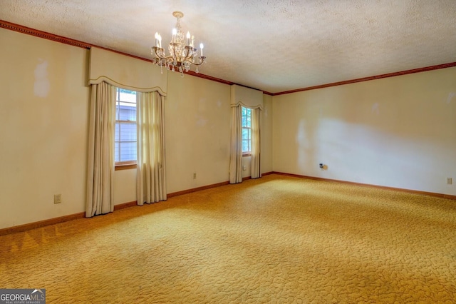 unfurnished room featuring ornamental molding, carpet, a chandelier, and a textured ceiling