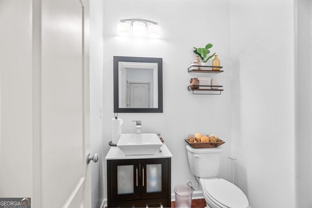 bathroom with toilet and vanity